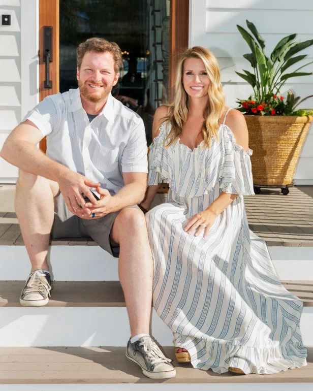 Dale Earnhart Jr. and wife Amy pose for a outside their Key West house, as seen on DIYÕs Renovations Realities: Dale Jr. & Amy. (portrait)