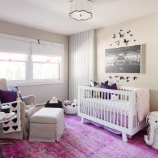 Black and White Contemporary Nursery With Pink Rug
