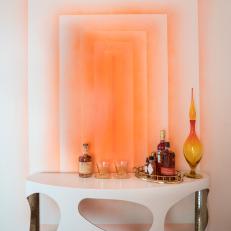Modern Living Room Detail With Orange And White Accent Wall And Modern Console Bar