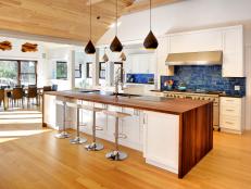 midcentury modern kitchen with wood island