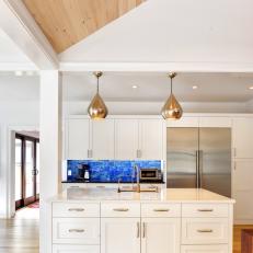 Gold Pulls Complement Pendant Lights in Kitchen