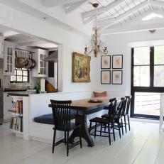 Black and White Kitchen/Dining Area with Banquette Seating 