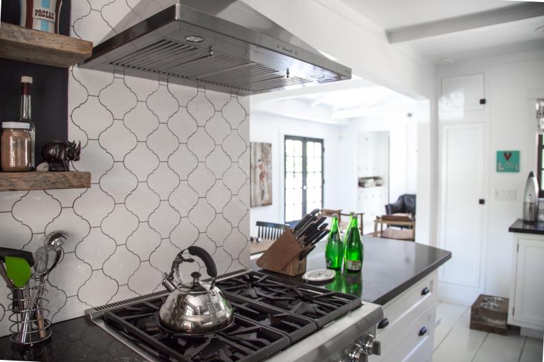 A cottage style kitchen with a white ceramic tile for the backsplash.
