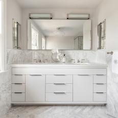 White Master Bathroom With Marble Backsplash