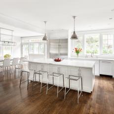White Eat-In Kitchen With Hardwood Floor