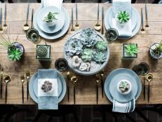 Agate, geodes and the fun addition of porcupine quills add an unexpected flourish to this tablescape featuring echeveria, tillandsia and cactus.  “This is a simple design to try at home,” says Sara Fried of Fete Nashville: Luxury Weddings, a wedding and event planning firm.  “Unlike many high-end tablescapes, succulents and cacti can be a fool-proof design option. They arrive with personality.”

“I love when a client chooses to about-face from the traditional and opt for succulent tablescapes,” says Fried. “I’m beginning to see a shift with what was once a minimalist look into fully-designed, color-driven pieces packed with design elements that span geode, quills, feathers, stone, and wood. It’s striking in a way that floral often can’t provide.” 

