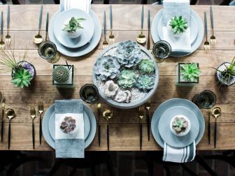 Agate, geodes and the fun addition of porcupine quills add an unexpected flourish to this tablescape featuring echeveria, tillandsia and cactus.  “This is a simple design to try at home,” says Sara Fried of Fete Nashville: Luxury Weddings, a wedding and event planning firm.  “Unlike many high-end tablescapes, succulents and cacti can be a fool-proof design option. They arrive with personality.”

“I love when a client chooses to about-face from the traditional and opt for succulent tablescapes,” says Fried. “I’m beginning to see a shift with what was once a minimalist look into fully-designed, color-driven pieces packed with design elements that span geode, quills, feathers, stone, and wood. It’s striking in a way that floral often can’t provide.” 

