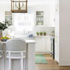 Kitchen Island Includes Blue-Striped Barstools