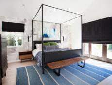 contemporary master suite with blue rug