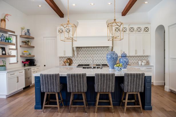 contemporary white kitchen with blue island