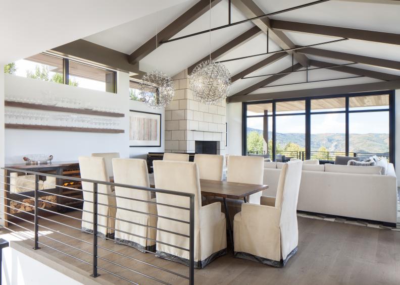 contemporary dining room with metal railing