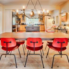 Contemporary Dining Room With Bright Orange Chairs