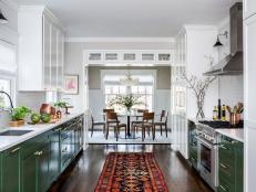 transitional galley kitchen with green cabinets