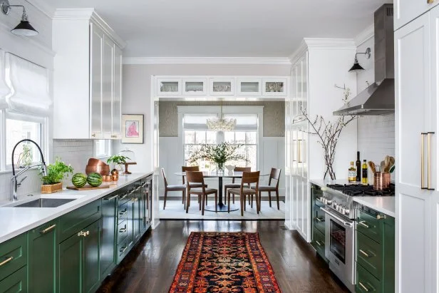 transitional galley kitchen with green cabinets