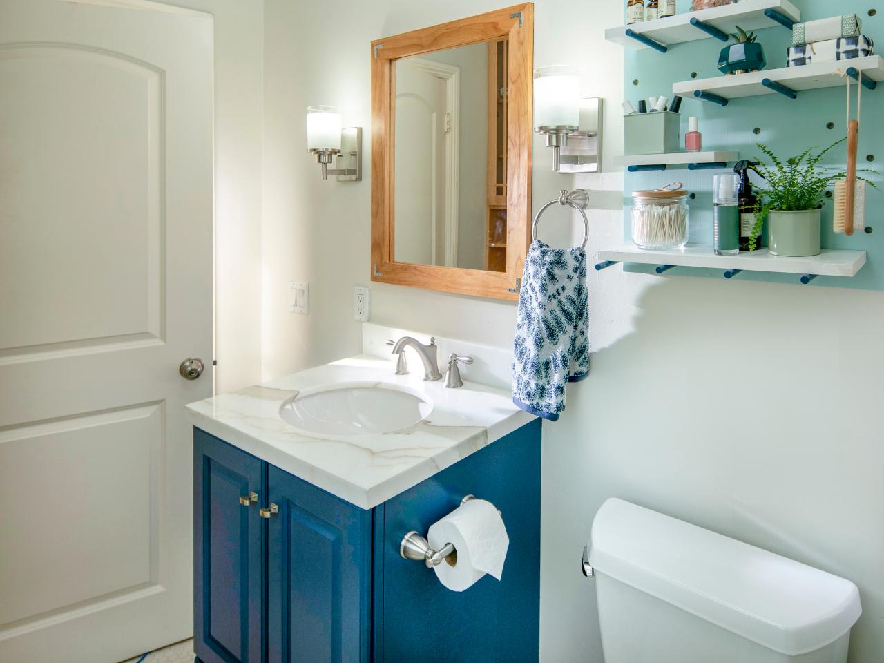 bathroom update: add a frame to a mirror and paint a vanity | hgtv