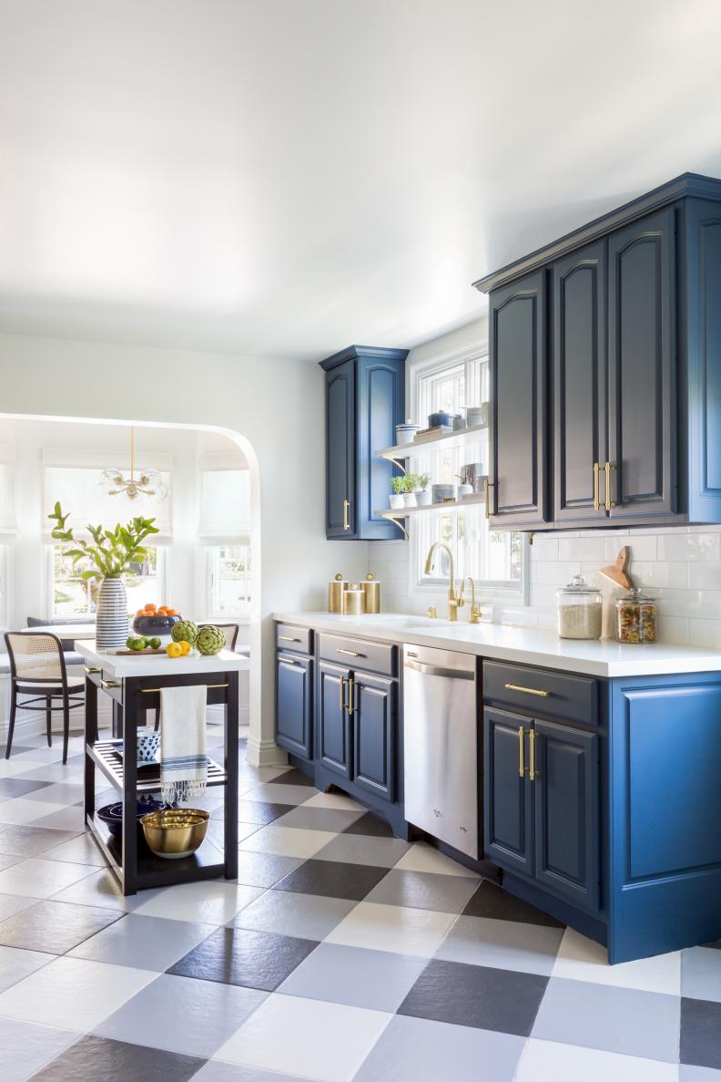 A kitchen with blue and white buffalo check tile floors. 