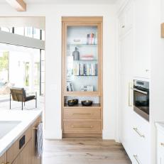 Modern White Kitchen Includes Built-In Bookshelf