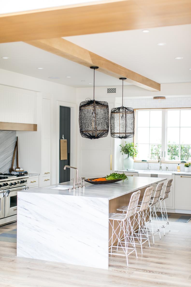 modern white kitchen with marble island