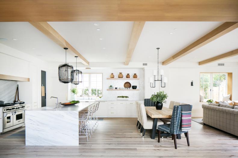 eclectic white kitchen with wood beams