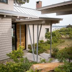 Modern Seaside Cottage Entrance With Covered Walkway And Metal Roof