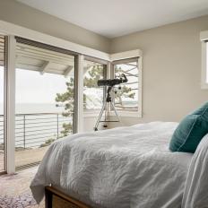 Modern White Cottage Master Bedroom With Deck