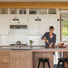 Modern Cottage Kitchen With White Cabinets And Modern Work Island And Pendants