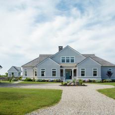Gray Farmhouse Exterior and Gravel Driveway