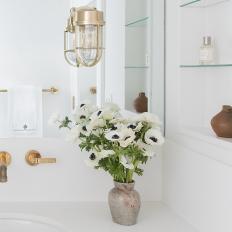 Floating Glass Shelves Lighten Guest Bathroom
