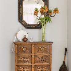 Eclectic Entryway With Antique Mirror, Cabinet