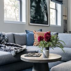 Gray Sectional and Concrete Coffee Table