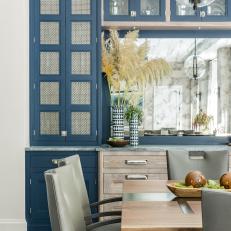 Contemporary Dining Room With Blue Cabinet
