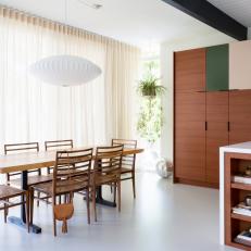 Midcentury Modern Eat-In Kitchen With Green Cabinet