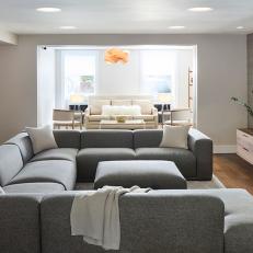 Family Room With Gray Sectional Sofa and Ottoman
