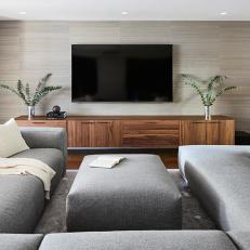 Family Room With Gray Sectional Sofa and Wide Console Table