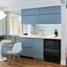 Contemporary Wet Bar With Blue Cabinets and Wine Fridge