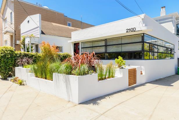 White Midcentury Modern House With Concrete Planter Walls And Wood Gate Hgtv