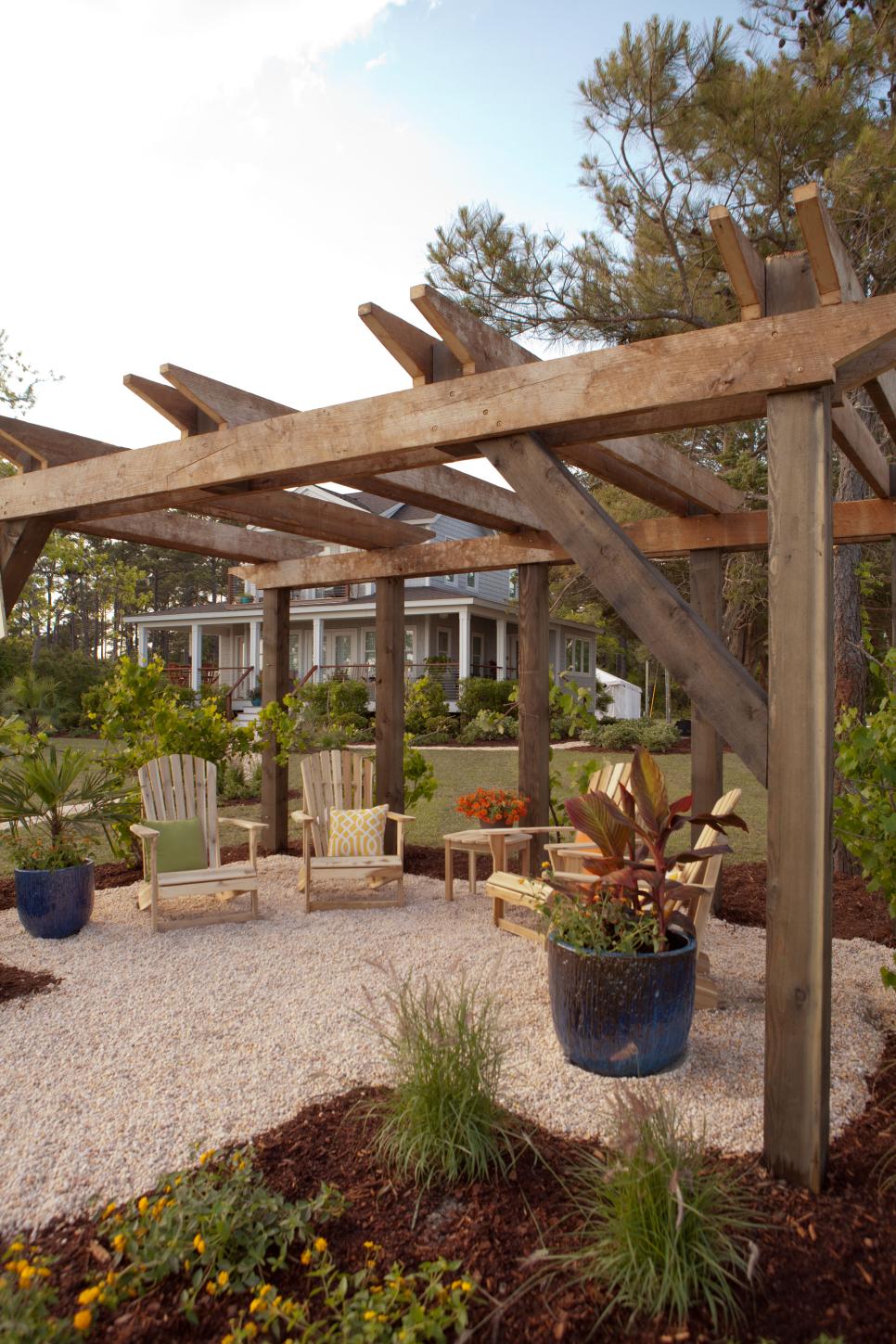 Rustic Pergola With Container Plantings and Adirondack Chairs | HGTV