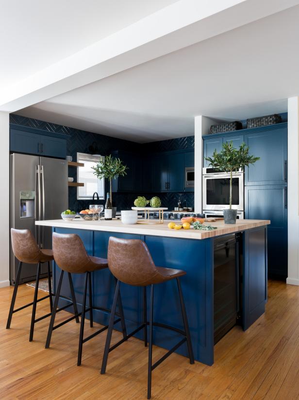 A warm blue cabinets bring a fabulous flair to this kitchen. 