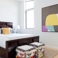 Modern Bedroom With Colorful Ottomans