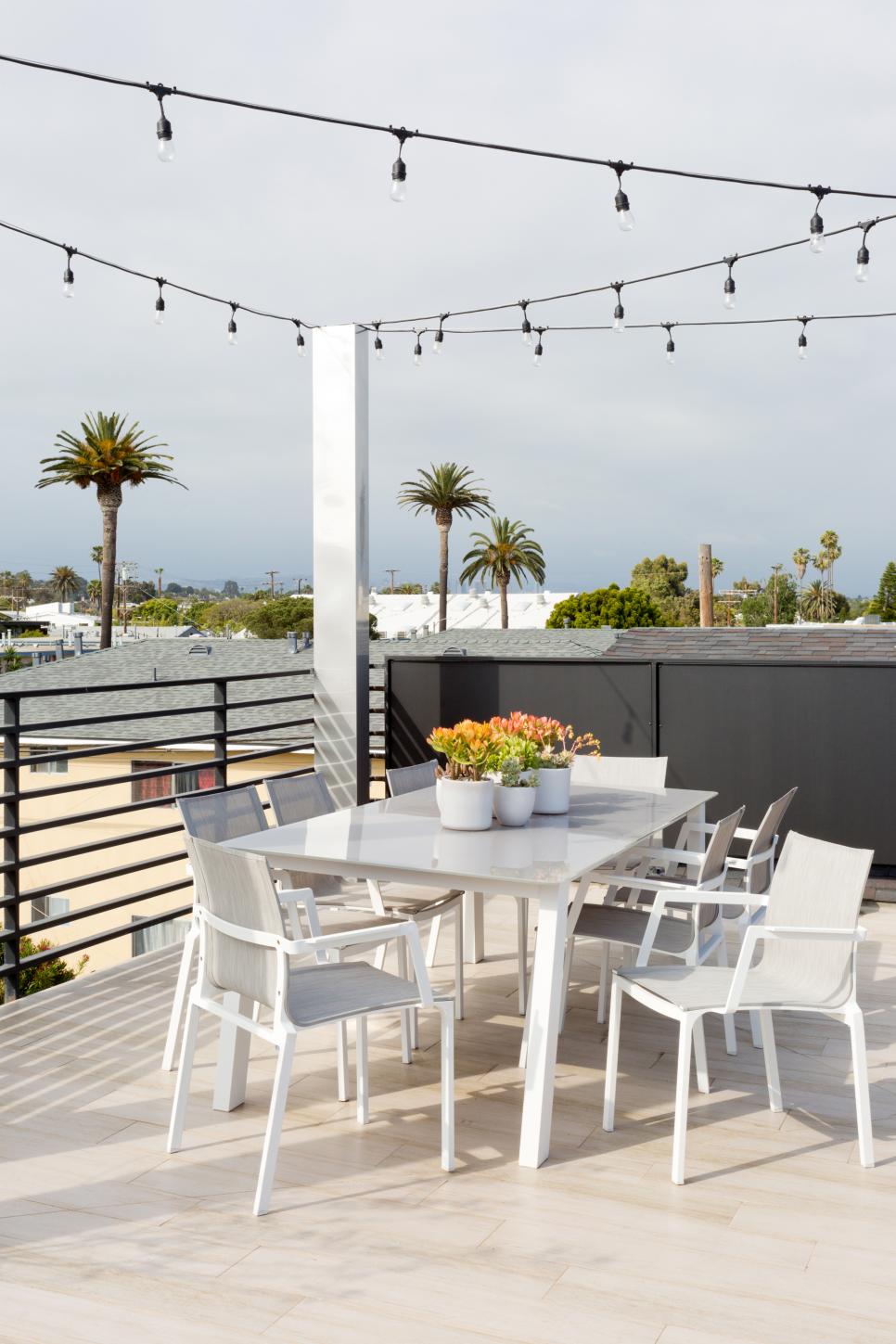 Modern Rooftop Patio With String Lights | HGTV