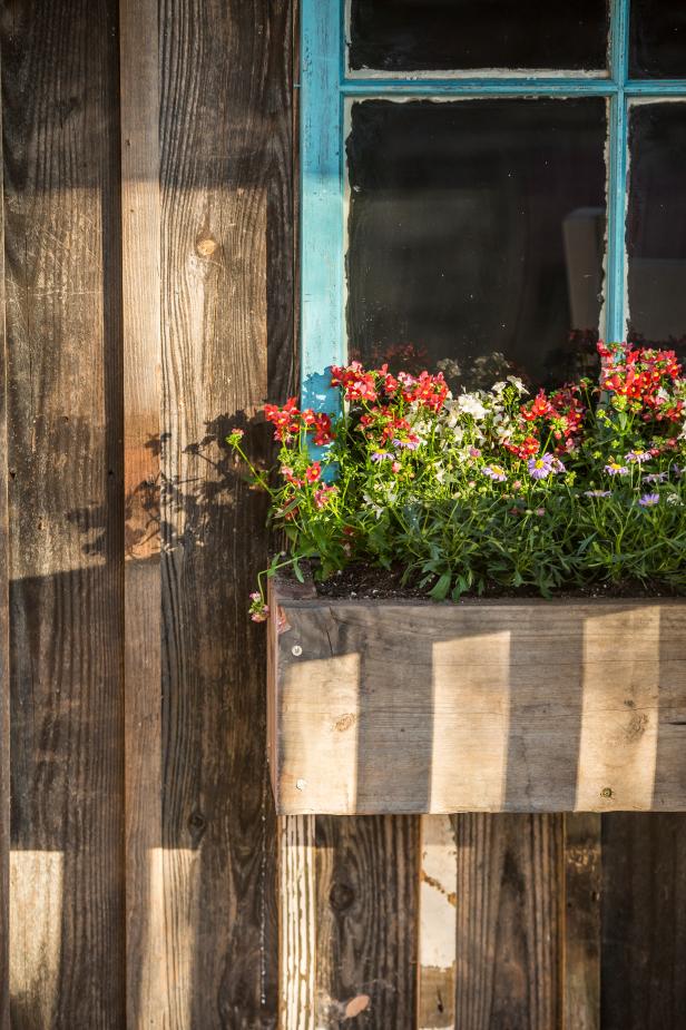 Blue Framed Window With Flower Filled Rustic Wood Window Box Hgtv