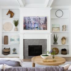 Gray Fireplace With Built-In Shelves