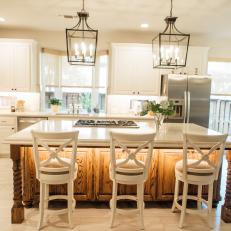 Traditional White Kitchen With Work Island And Seating