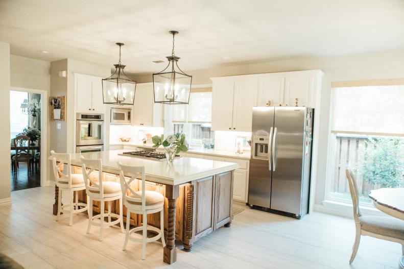 Traditional White Kitchen With Pendant Lights And Work Island