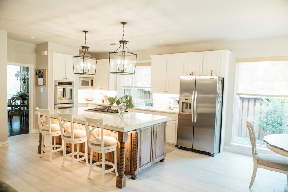 Traditional White Kitchen With Pendant Lights And Work Island