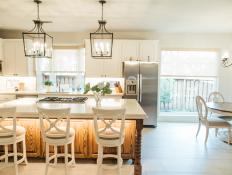 Traditional Kitchen With Work Island And Decorative Pendant Lights