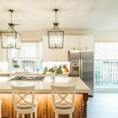 Contemporary White Kitchen With Work Island And Pendant Lights