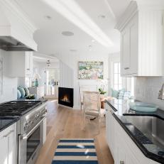 White Galley Kitchen With Striped Rug