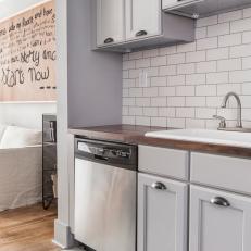 Gray Open Plan Kitchen With Subway Tile