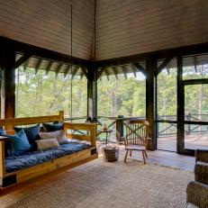 Rustic Screen Porch With Swing
